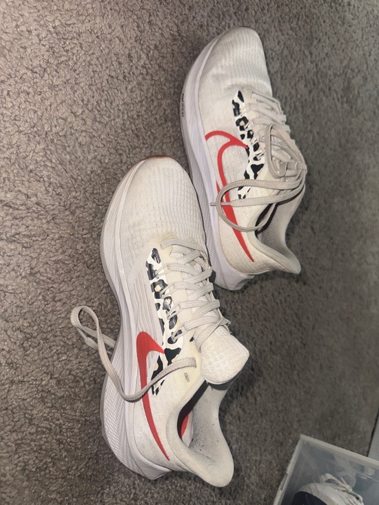 Nike Shoes - Nike White Running Shoes with Red Swoosh and Black Leopard Accent